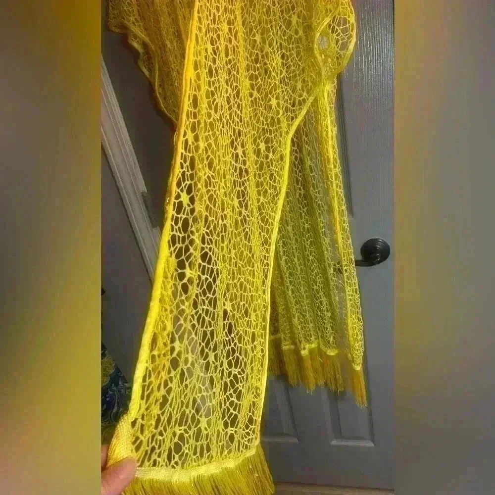 Yellow coverup for swimsuit or casual wear. Fits like a medium
